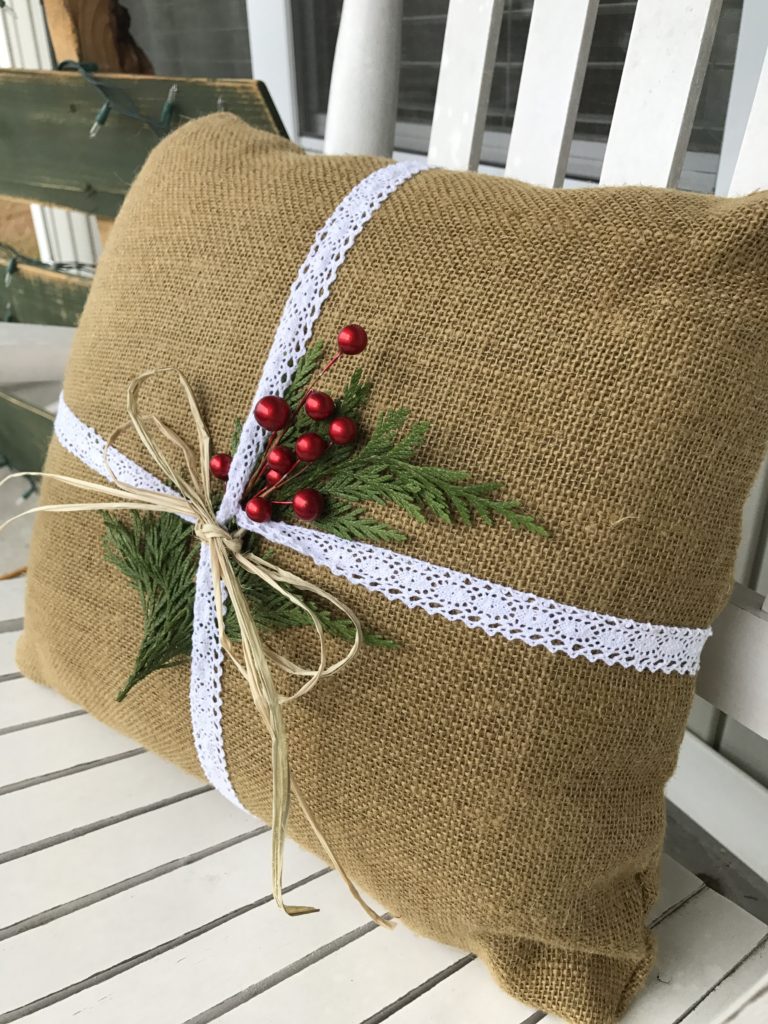 Final product. Burlap pillow upgrade to Christmas burlap pillow for front porch rocking chair. Rainy day Christmas crafts you can do with your kids.