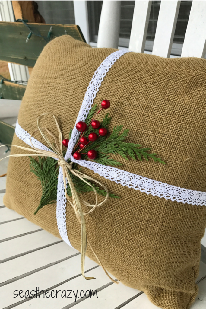 Final product. Burlap pillow upgrade to Christmas burlap pillow for front porch rocking chair. Rainy day Christmas crafts you can do with your kids. seasthecrazy.com