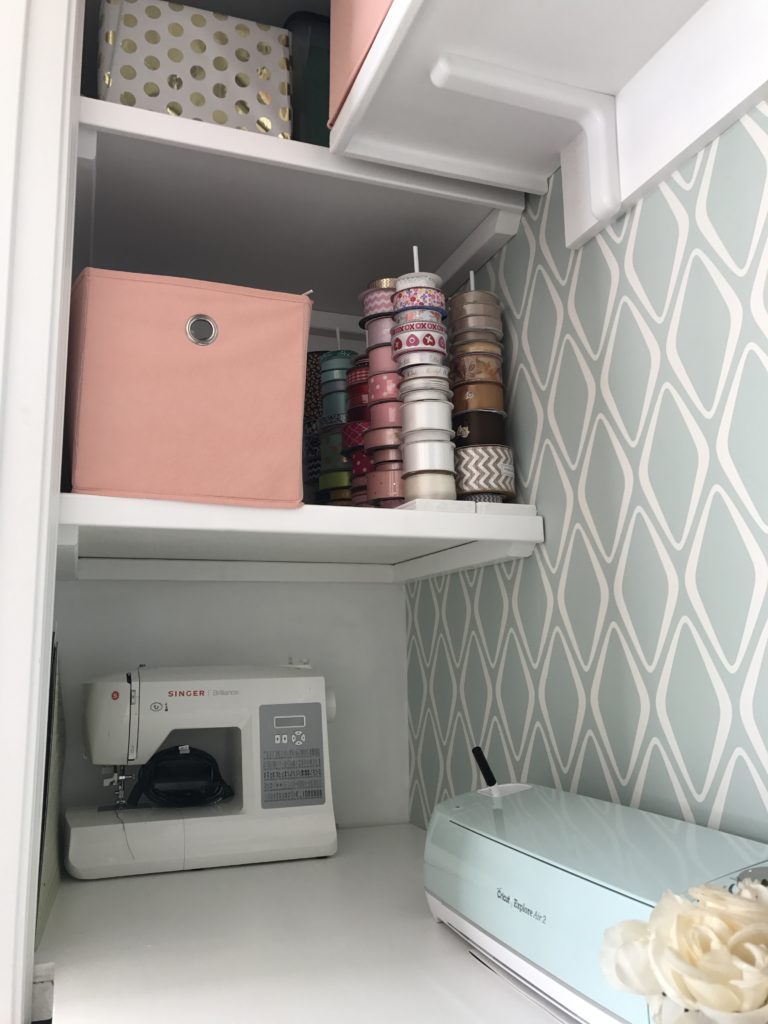 Here is a close up of the left side of the desktop and 2 of the 3 side shelves following the closet office makeover. I love that the sewing machine and Cricut have their own space. Want to find out more? Check out the blog post Closet Office Makeover