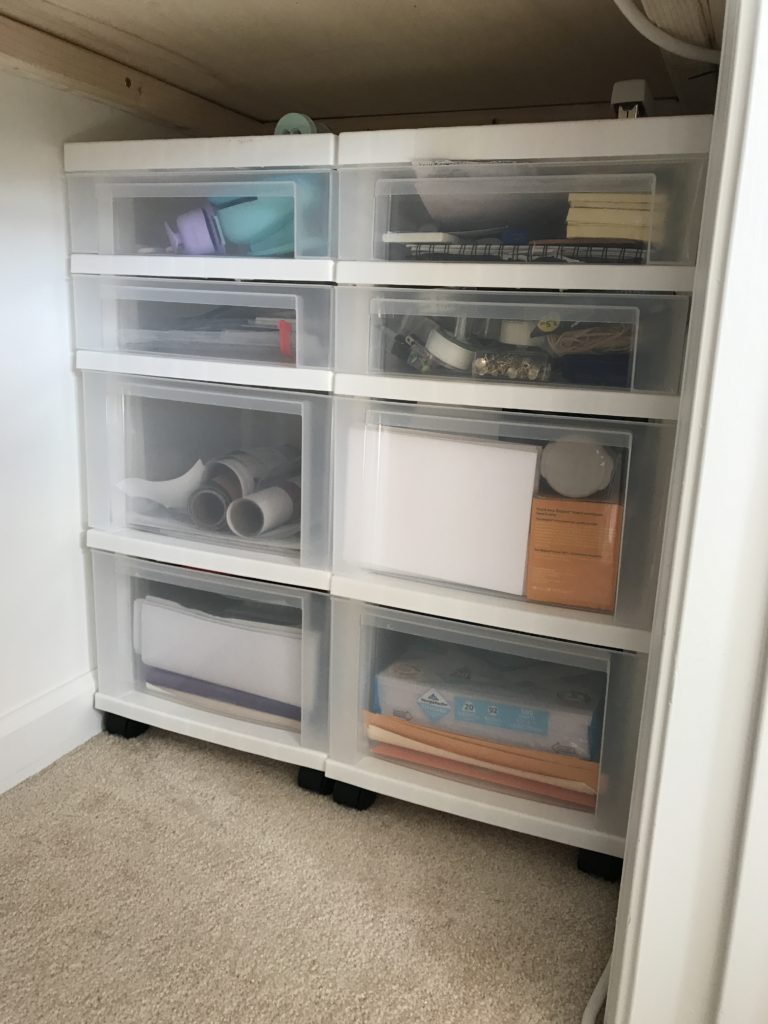 One of my favorite finds for the closet office makeover were these rolling storage carts. They are lightweight and on wheels, and lucky enough 2 of them fit side by side in the deadspace to the right under the desktop! I can wheel them out when I need them, and store them when I don't.