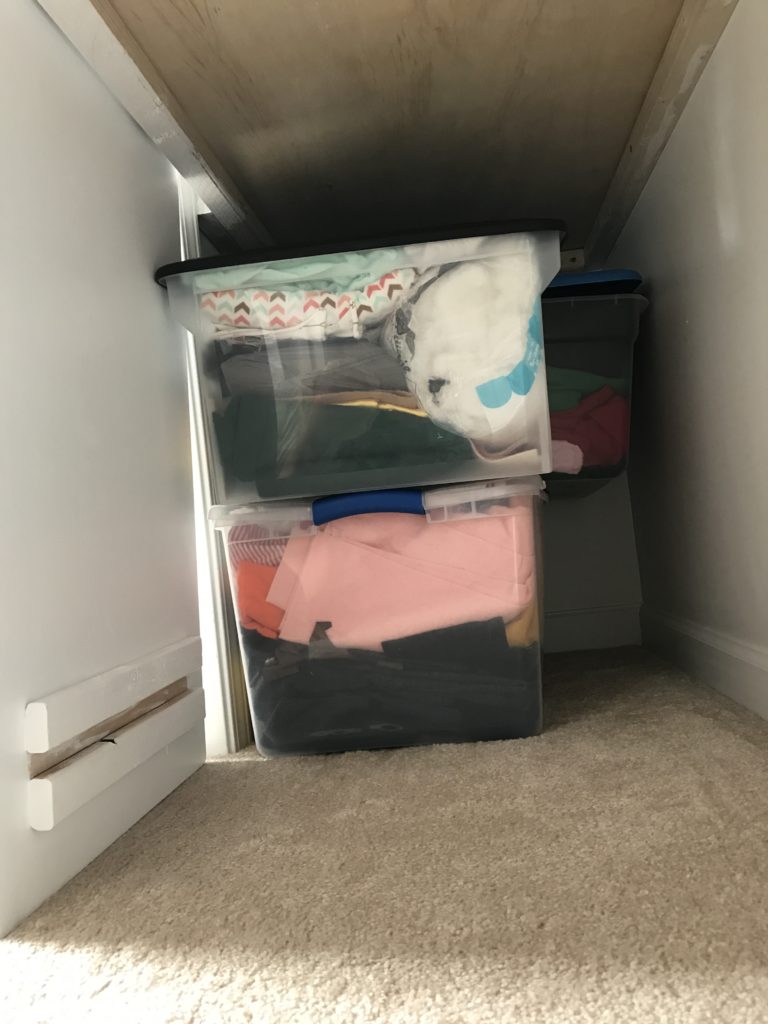 This is not the prettiest picture, but it's real life. The deadspace under the desk top to the left (to the left of the workspace extension) made the perfect spot to store my fabric bins.